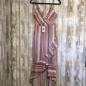 Brand new with tags never worn size large dress with belt high low design